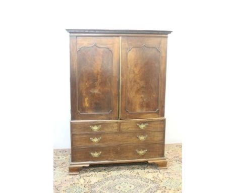 Good quality 18th century mahogany linen press with dentil cornice and two arch panelled doors enclosing four slides, with tw