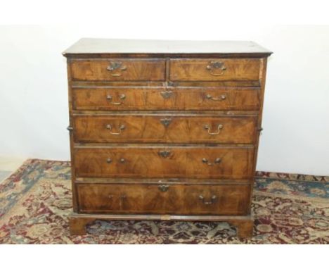 George II inlaid walnut chest of two short and four long graduated drawers below on bracket feet, 106cm high, 104cm wide, 50c