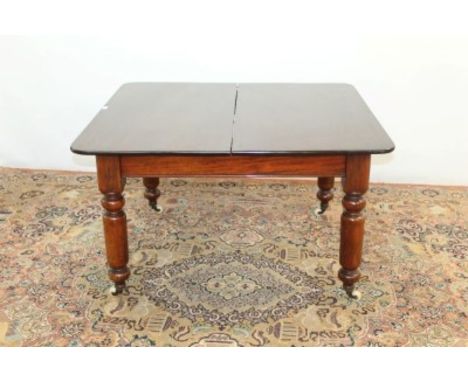 Victorian mahogany extending dining table with three extra leaves on turned legs and ceramic castors opening to 237cm x 108cm