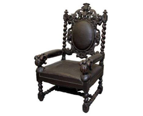 Impressive Victorian carved oak Baronial throne chair in the Carolean revival taste, with crowned helm cresting and knights h