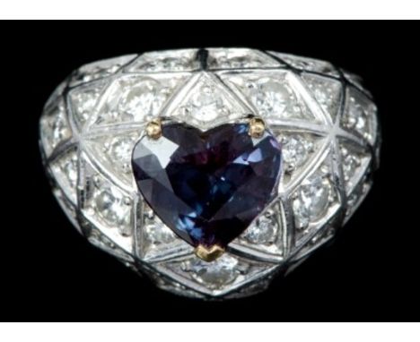 Platinum and gold alexandrite and diamond bombe cluster ring, a heart-shaped alexandrite with a believed weight of 2.66 carat