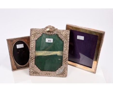 Late Victorian silver photograph frame of rectangular form, with rococo scroll and floral decoration and easel back (Birmingh