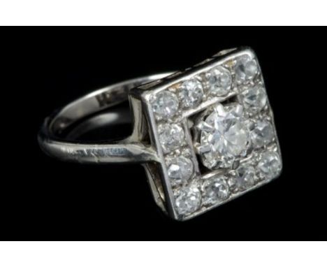 Art Deco diamond cluster ring with a central old cut diamond estimated to weigh approximately 0.50 carats, in claw setting wi