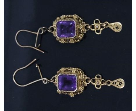 Pair amethyst pendant earrings, each with a rectangular step cut amethyst in yellow metal cannetille surround, 55mm x 14mm