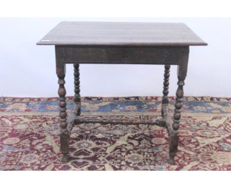 Early 18th century oak side table on bobbin-turned legs joined by stretchers, 72cm high x 82cm wide x 61cm deep