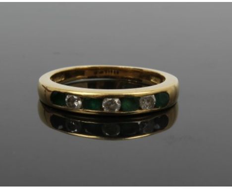 Gold (18ct) emerald and diamond eternity ring with three brilliant cut diamonds and four round mixed cut emeralds in channel 