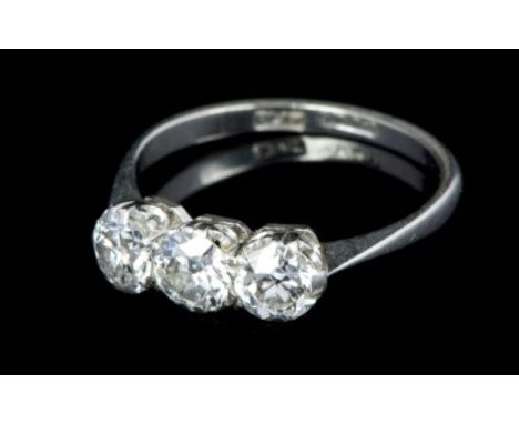 Diamond three stone ring with three old cut diamonds in claw setting on platinum shank.  Estimated total diamond weight appro