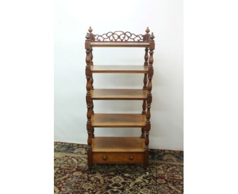 Victorian mahogany fiver tier whatnot with pierced ledge back and turned supports with drawer below, on ceramic castors, 165c