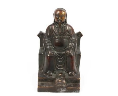Chinese patinated figure of a Deity, seated on a throne, on step, a cobra in front, mon and four character mark to reverse, 1