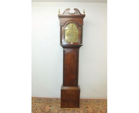 18th century longcase clock with eight day movement striking on a bell, brass break arch dial with brass chapter ring, subsid