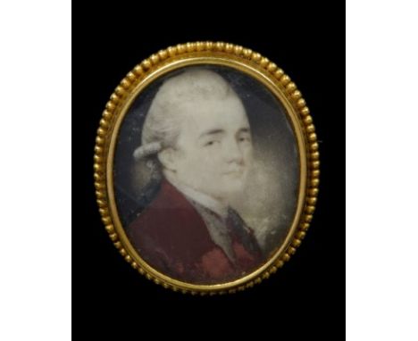 George III oval portrait miniature on ivory depicting a young gentleman wearing powdered wig and red coat, in an oval yellow 