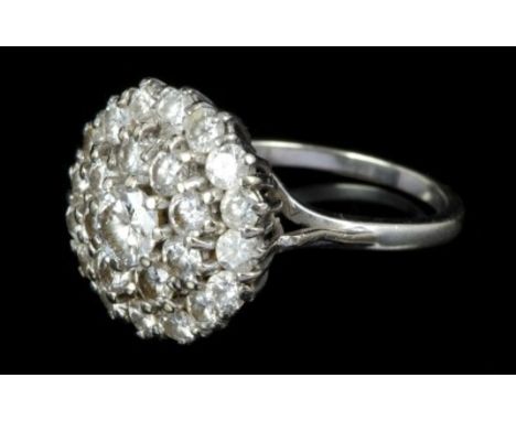 Diamond cluster ring with a central brilliant cut diamond estimated to weigh approximately 0.40 carats, surrounded by twenty-