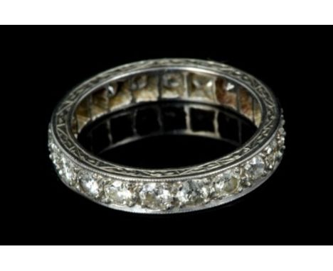 Diamond eternity ring with a full band of twenty old cut and brilliant cut diamonds in precious white metal setting.  Estimat