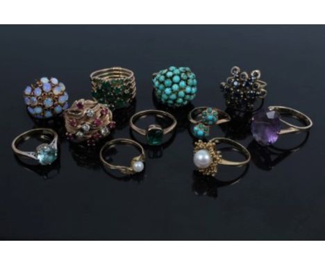 Collection of eleven gold and yellow metal gem set dress rings including emerald single stone ring, ruby and diamond cluster 