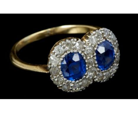 Late Victorian sapphire and diamond double-cluster ring with two interlocking flower-head clusters, each centred with an oval