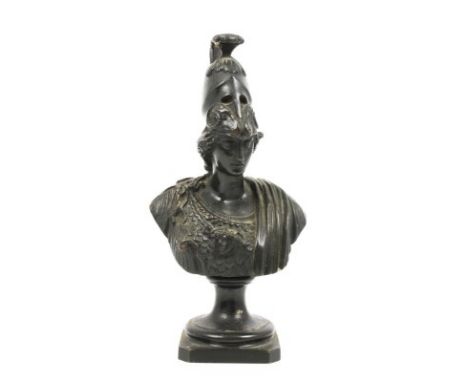 Small patinated bust of classical female warrior wearing a plumed helmet, raised on a socle base, 20cm high