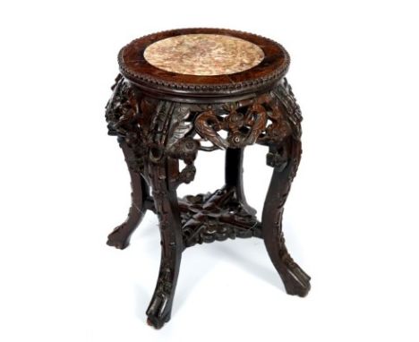 Late 19th century Chinese hardwood plant stand with carved bird and prunus decoration, circular top and inlaid marble panel o