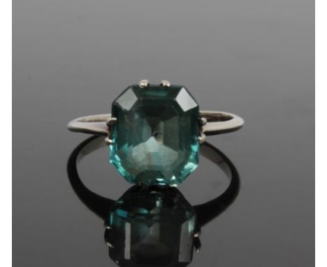 Art Deco blue zircon single stone ring with an octagonal step cut blue zircon in claw setting on white metal shank.  Ring siz