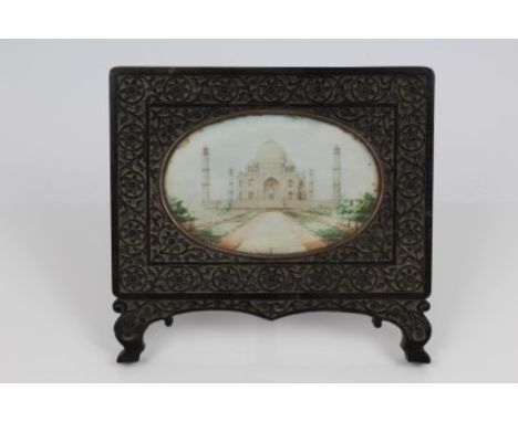19th century Anglo-Indian oval miniature painted with a scene depicting the Taj Mahal, mounted in an ebonised easel frame wit