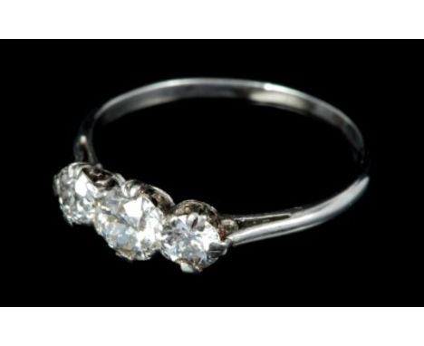 Diamond three stone ring with three old cut diamonds in claw setting on precious white metal shank.  Estimated total diamond 