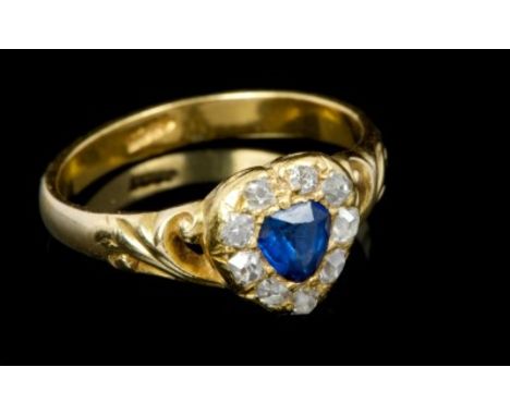 Victorian sapphire and diamond heart-shape cluster ring with a central blue sapphire surrounded by nine old cut diamonds in g