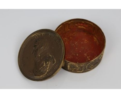 Early 19th century Lord Nelson commemorative gilt brass box decorated with his portrait, military trophies, etc, 5.5cm