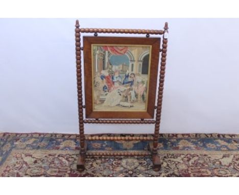 Victorian mahogany framed fire screen with central tapestry panel depicting figures, on bobbin turned frame and bun feet, 125