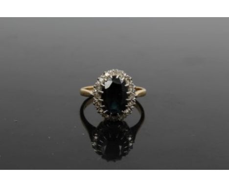 Gold (18ct) sapphire and diamond oval cluster ring.  Ring size O