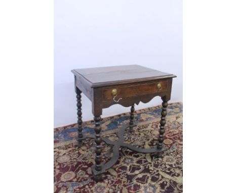 Early 18th century oak side table with single drawer, on bobbin-turned legs joined by X-frame stretchers