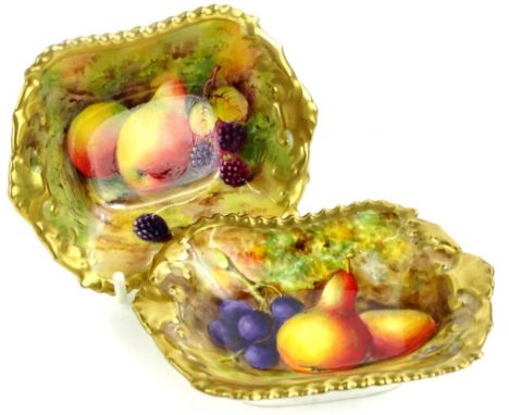 A pair of Royal Worcester porcelain rectangular dishes, each decorated with fruit within gilt borders, signed N Ayrton to one