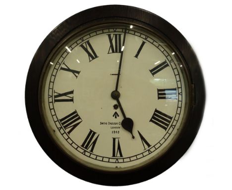 An ebonised wall clock, the painted dial bearing inscription Smiths English Works Limited, with military arrow and bearing da