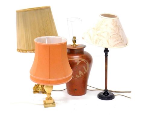 A collection of table lamps, to include a marble example, a bronzed base metal table lamp, a gilt table lamp, and an Eastern 