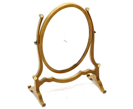 A 20thC mahogany dressing table mirror, the oval plate on shaped supports, with splayed feet, 37cm W. (AF)Provenance: The pro
