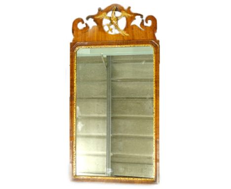 A George III mahogany fret frame wall mirror, the later rectangular plate with a gilt slip, the crest decorated with a ho-ho 