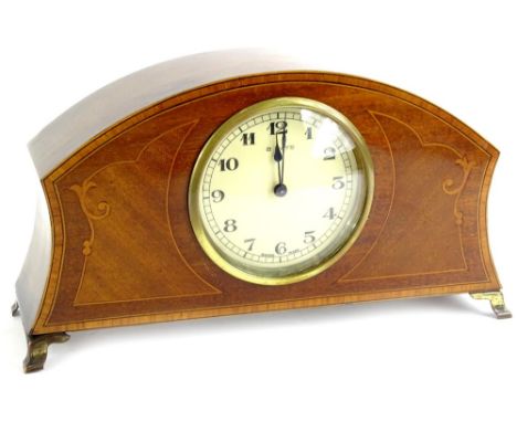 An Edwardian mahogany and marquetry mantel clock, stamped eight days Swiss made on brass ogee feet, 27cm W.