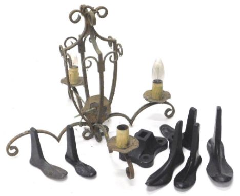 A quantity of metalware, to include a shoe makers last or stand, with attachments, and a wrought iron four branch chandelier.