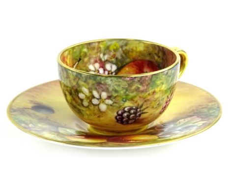 A Royal Worcester porcelain miniature cup and saucer, painted with fruit by J Skerrett, printed marks in black to underside.