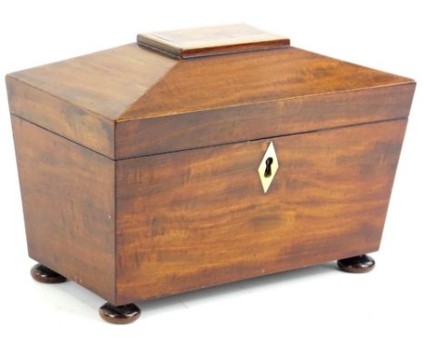 A 19thC mahogany sarcophagus tea caddy, of rectangular form with part fitted interior on compressed bun feet, 21cm H, 26cm W,