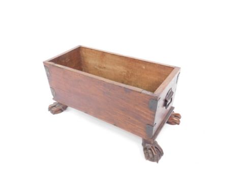 An oak and iron bound trough, jardinere or wine cooler, with a pair of carrying handles, raised on ball and claw feet, 35cm H