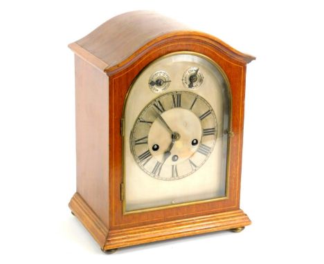 An early 20thC mahogany mantel clock, the silvered dial with subsidiary slow fast and chime silent dials, on bun feet, 32cm H