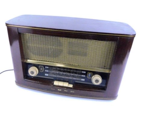 A vintage Bush radio, in a walnut case, type VHF.72, 48cm W.