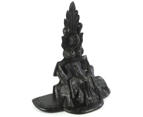 A late 19th/ early 20thC Continental ebonised wooden wall bracket, decorated with three birds, berries, etc., 38cm W.