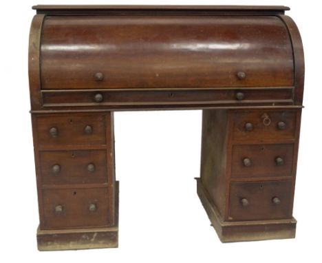 A Victorian mahogany cylinder top estate desk, with a bird's eye maple veneered interior with drawers and pigeon holes, each 