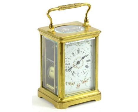 An early 20thC carriage clock, with fancy face decorated with flowers and a Roman numeric dial fronting a keywind movement, i