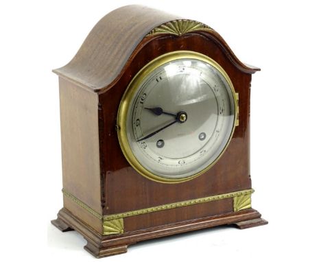 A mid 20thC walnut cased mantel clock, with 13cm dia Arabic dial, revealing an eight day key wind movement in a domed case on