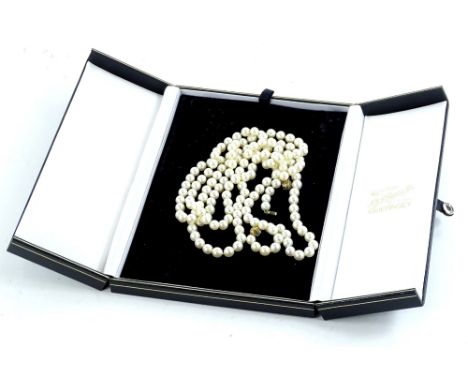 A cultured pearl necklace, each cultured pearl approximately 0.4mm wide, and designed with three gold interchangeable balls, 