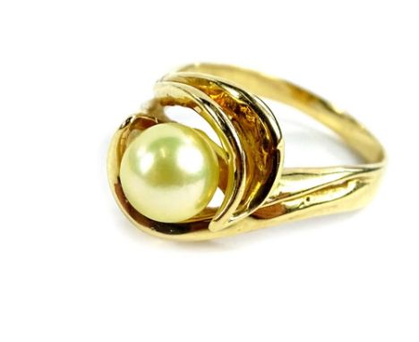 A cultured pearl dress ring, with single pearl in twist setting, yellow metal, marked 14K, ring size R, 5.7g all in. 