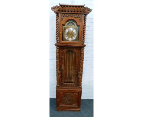 An oriental influence longcase clock, the case carved with dragons, the arched dial stamped Made In Germany 194cm H.