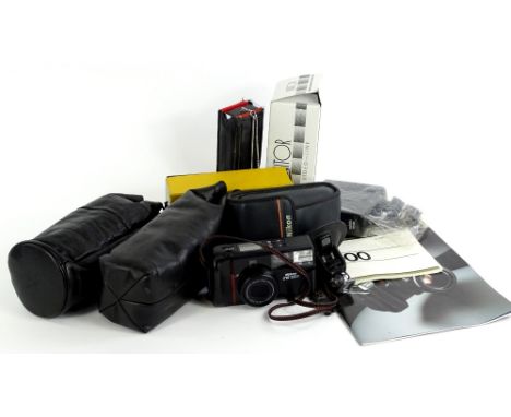 A quantity of camera equipment, to include Minolta automatic flash, Minolta lens, Nikon TW zoom camera etc.