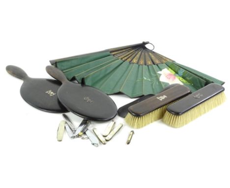 An early 20thC matched dressing table set etc., various pen knives, fruit knives, ebonised hand mirror, 28cm H, and others si